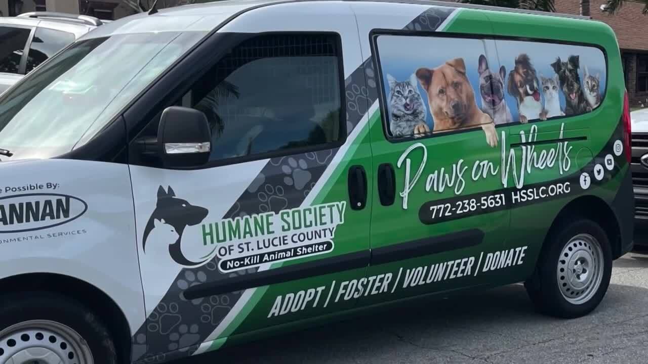 Humane Society of St. Lucie County van outside home full of poodles