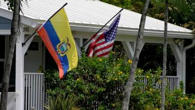 Colombia and American flags outside a home in Greenacres
