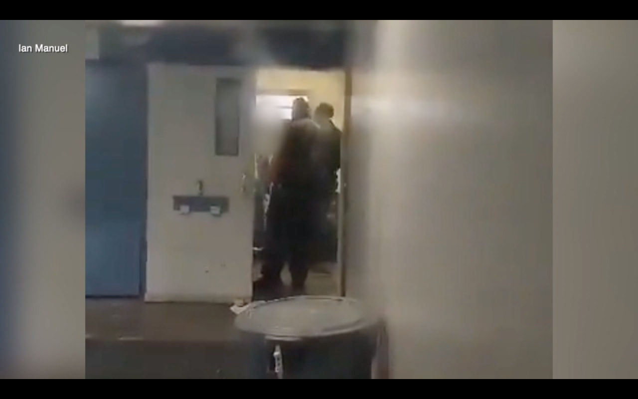 Screenshot of inmate being slapped