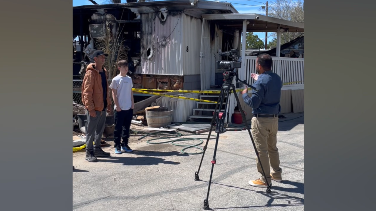 Neighborhood News Reporter Steve Virgen interviewing Jeff Kurth, and his son, who lost their home in the explosion and fire in Rosamond