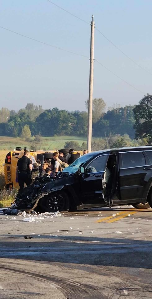 School bus rollover crash and damaged SUV