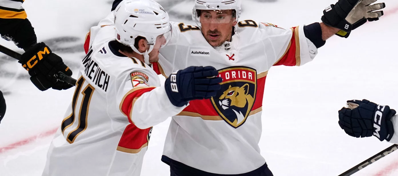 Florida Panthers left wing Brad Marchand, right, celebrates after a goal by right wing Mackie Samoskevich (11) during the first period of an NHL hockey game, Tuesday, Oct. 21, 2025, in Boston.
