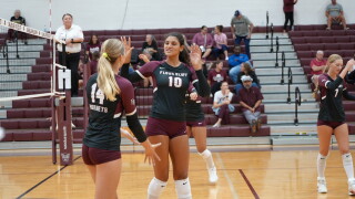 Flour Bluff's Nya White high fives Emily Eggleston