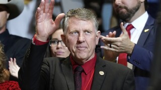 Former Republican Arizona state Sen. David Farnsworth waves to a cheering crowd as he is introduced by former President Donald Trump as Trump speaks at a Save America rally Friday, July 22, 2022, in Prescott, Ariz. Farnsworth is mounting a primary challenge to the current Arizona Speaker of the House in Republican Rusty Bowers. (AP Photo/Ross D. Franklin)

