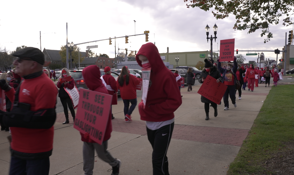 Hundreds of medical professionals picket outside of Sparrow Hospital