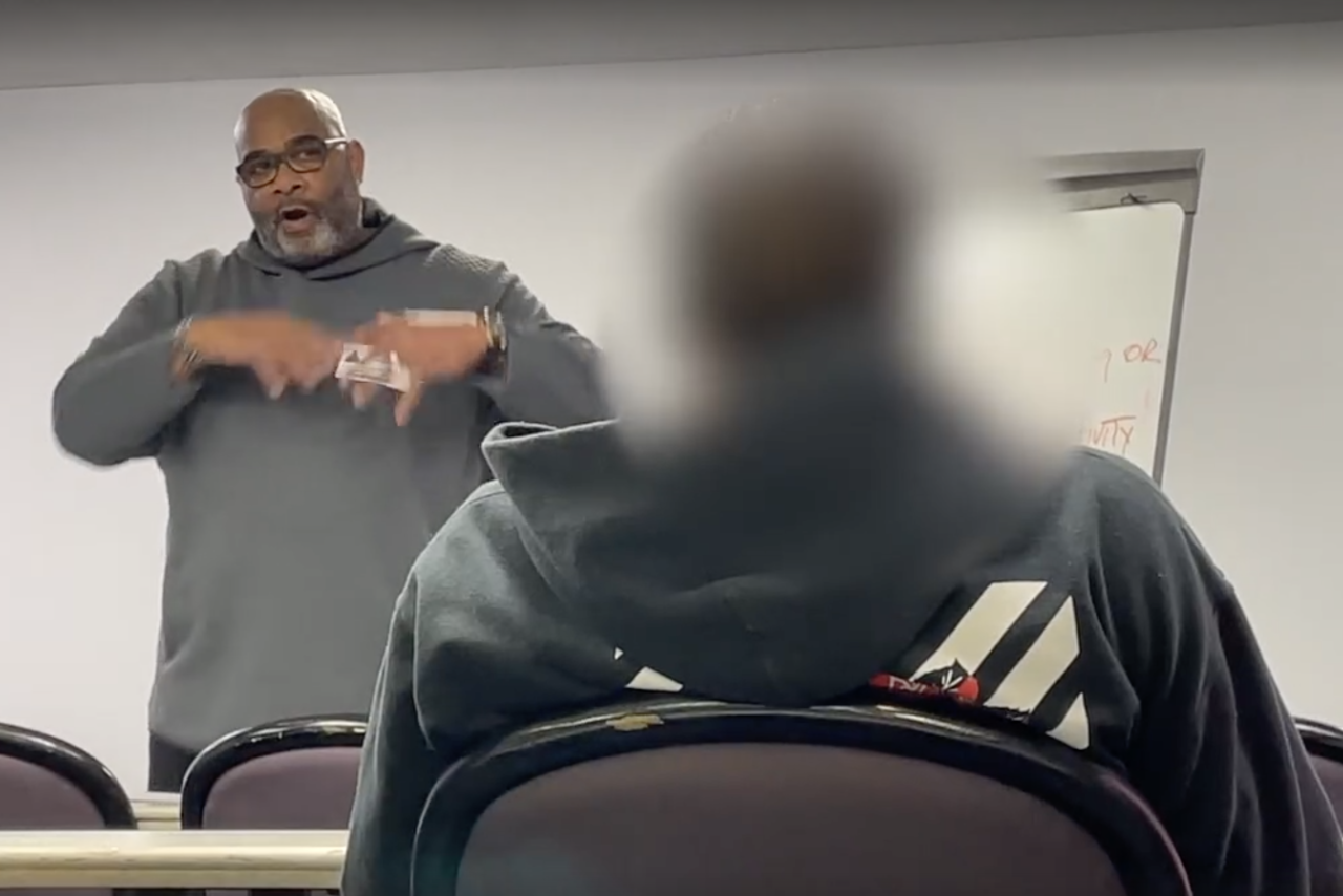 Stan Ross, the Executive Director of the nonprofit Positive Influence Team, leads a meeting with juvenile offenders accused of stealing cars