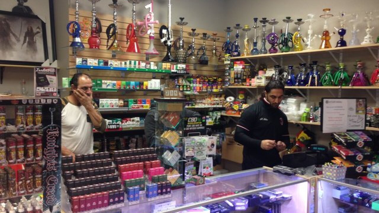 Smoke shop owner stands up to armed thief Smoke shop owner stands up to armed thief