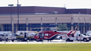 A medical helicopter sits outside Santa Fe High School in Texas