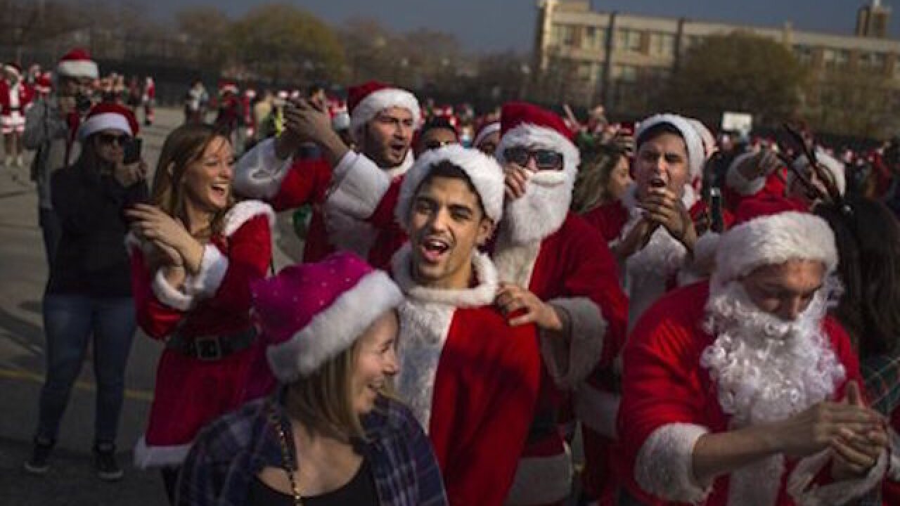 Thousands in costumes revel at festive SantaCon