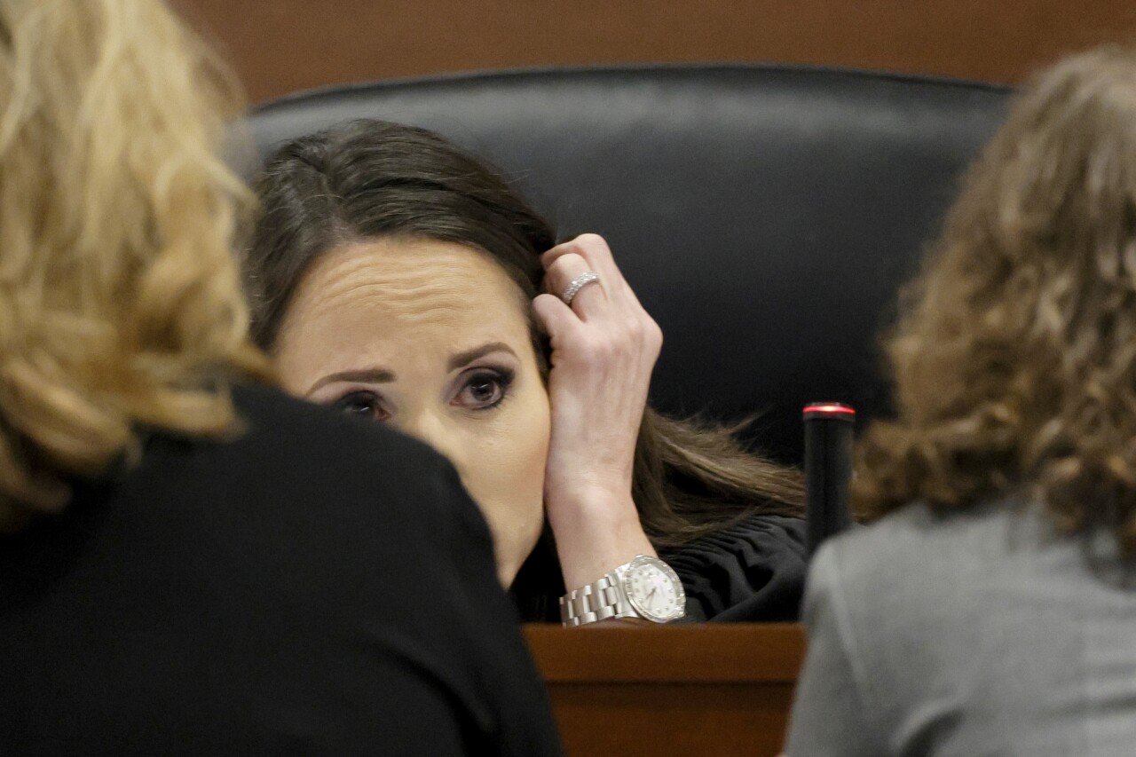 Judge Elizabeth Scherer speaks with Assistant State Attorney Carolyn McCann and Assistant Public Defender Tamara Curtis during jury selection of Nikolas Cruz murder trial, April 25, 2022