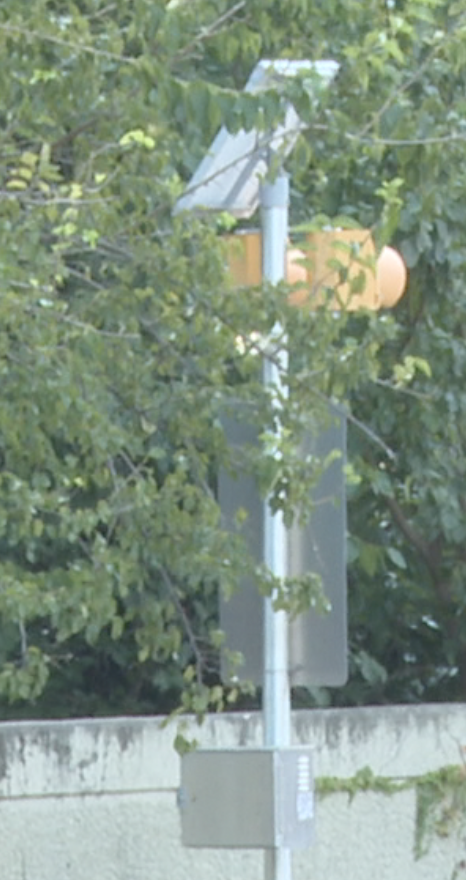 light on the back of school zone sign