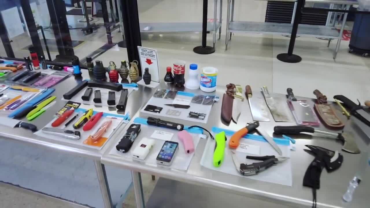 weapons seized at Fort Lauderdale-Hollywood International Airport on display halfway through 2021
