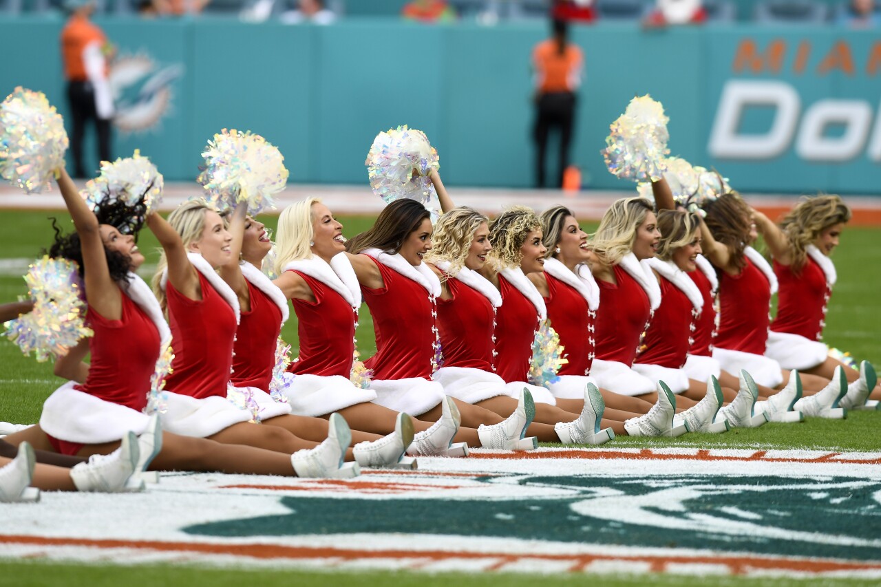 Miami Dolphins cheerleaders wearing Santa jackets perform during first half of Christmas Eve game vs. Dallas Cowboys, Dec. 24, 2023