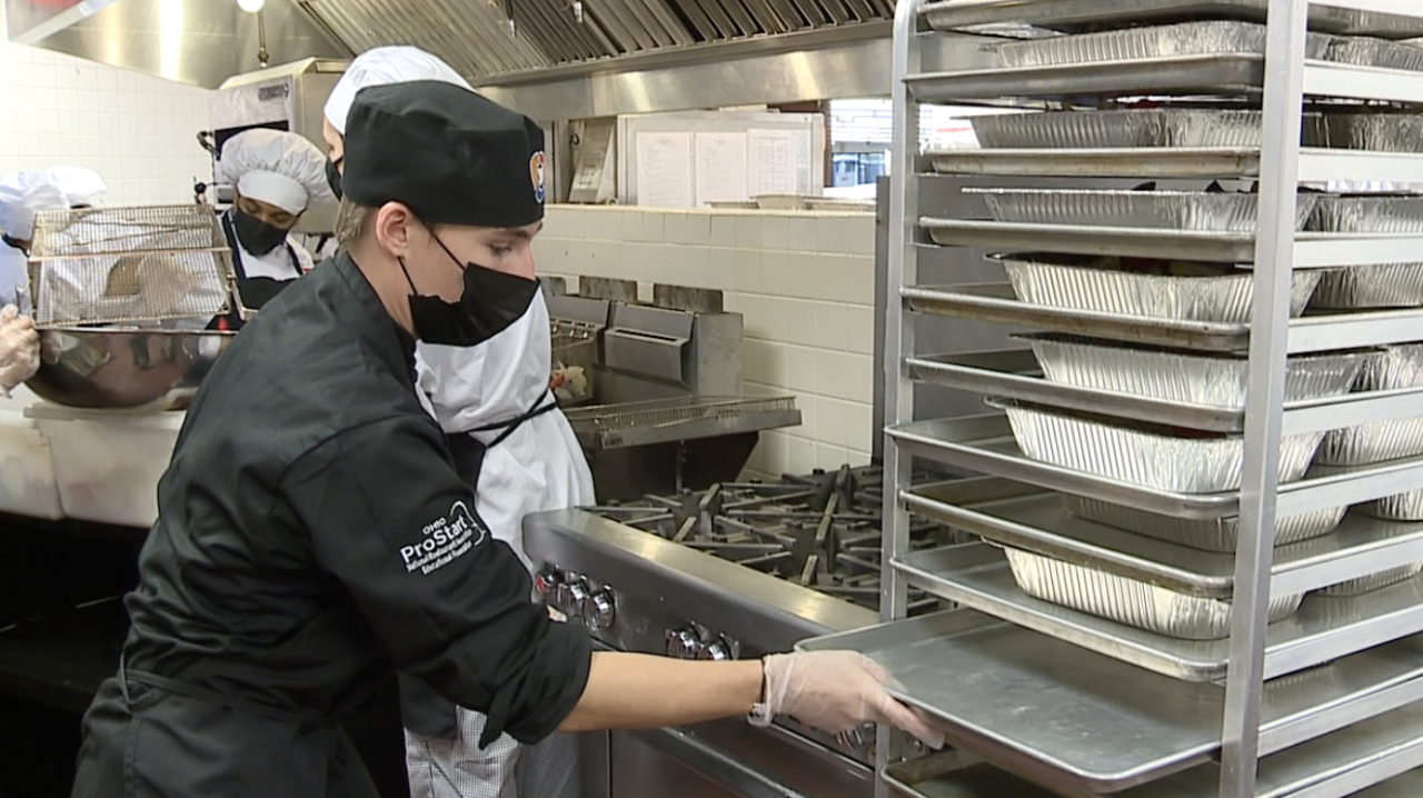 Liam Hartman working inside the Normandy High School kitchen