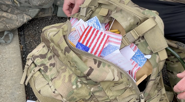 Goodin's pack filled with letters and homemade flags