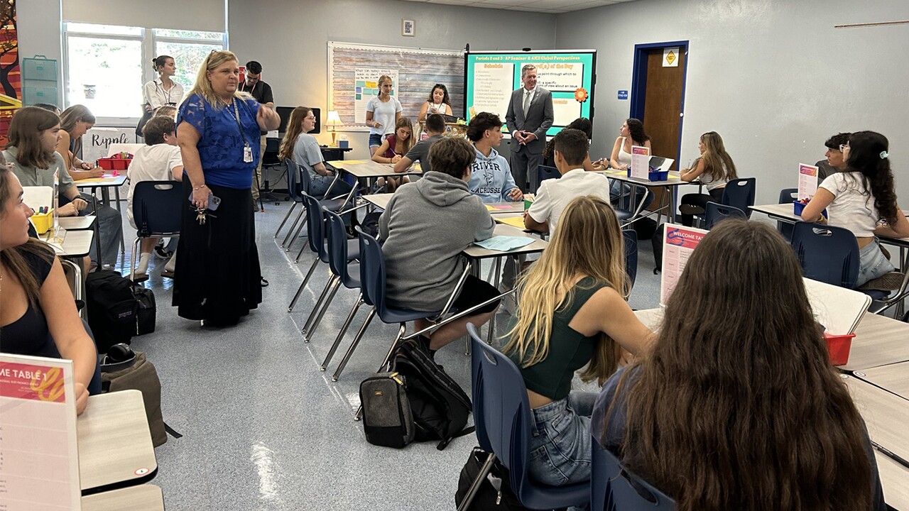 Dr. Allison Castellano, the principal of Spanish River Community High School in Boca Raton, speaks to students on the first day of school, Aug. 12, 2024.jpg