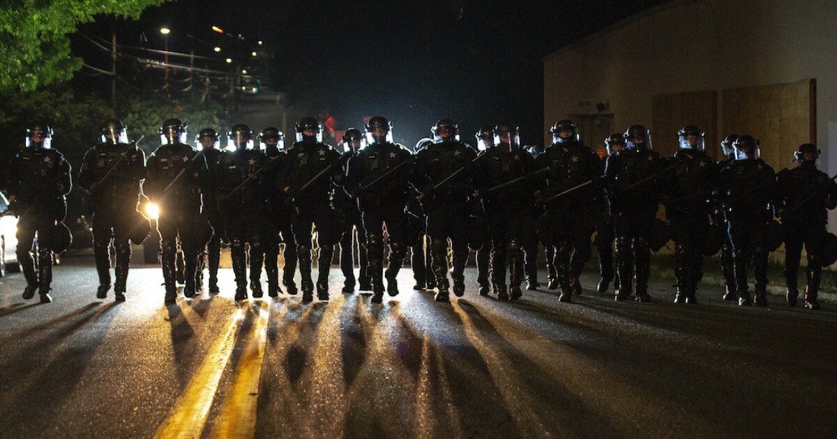 Portland police declare riot, use smoke to clear crowd
