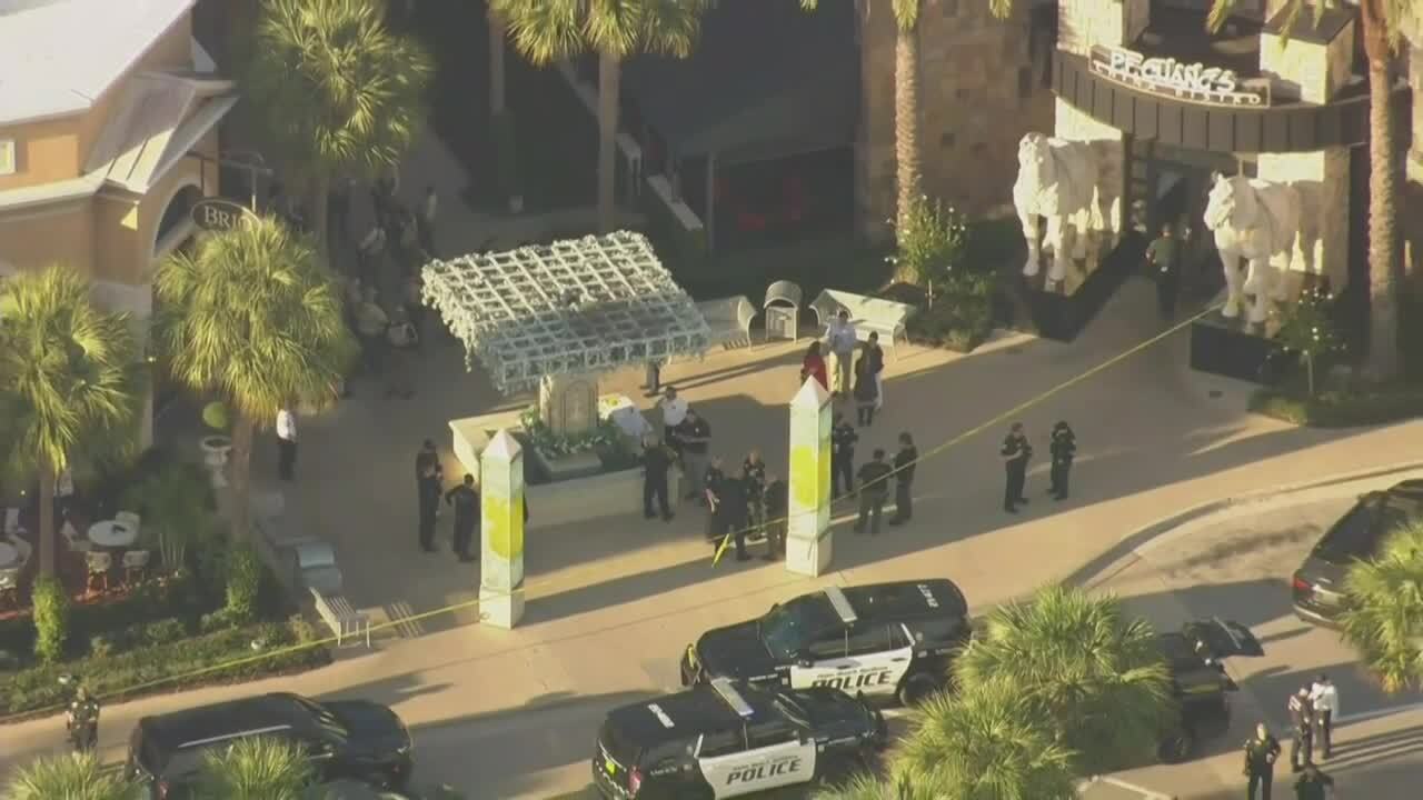 police and deputies outside P.F. Chang's at Gardens Mall, Feb. 14, 2024
