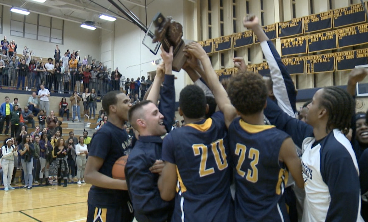 Godwin Heights celebrates the district championship after beating Wayland