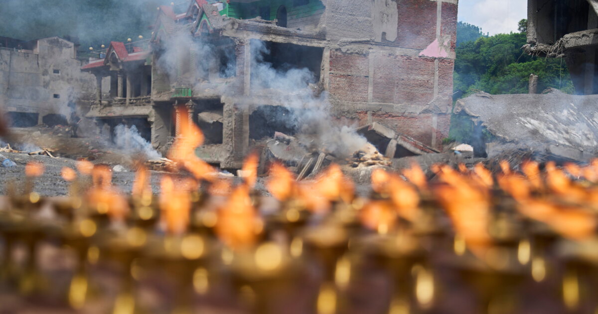 Nepal holds a day of mourning after floods kill at least 1,300 people