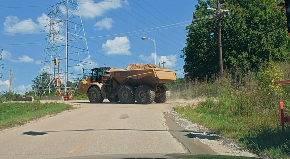 Pierce Township officials are considering closing Beckjord Road to Commercial Liability Partners or filing a lawsuit over $100,000 road repair costs.