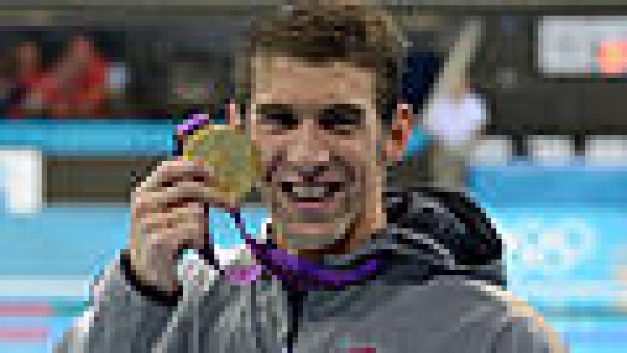Phelps wins record gold