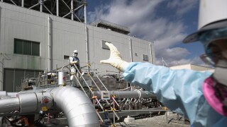 Employees work on the construction of the "ice wall" at the Fukushima Daiichi Nuclear Power Plant.