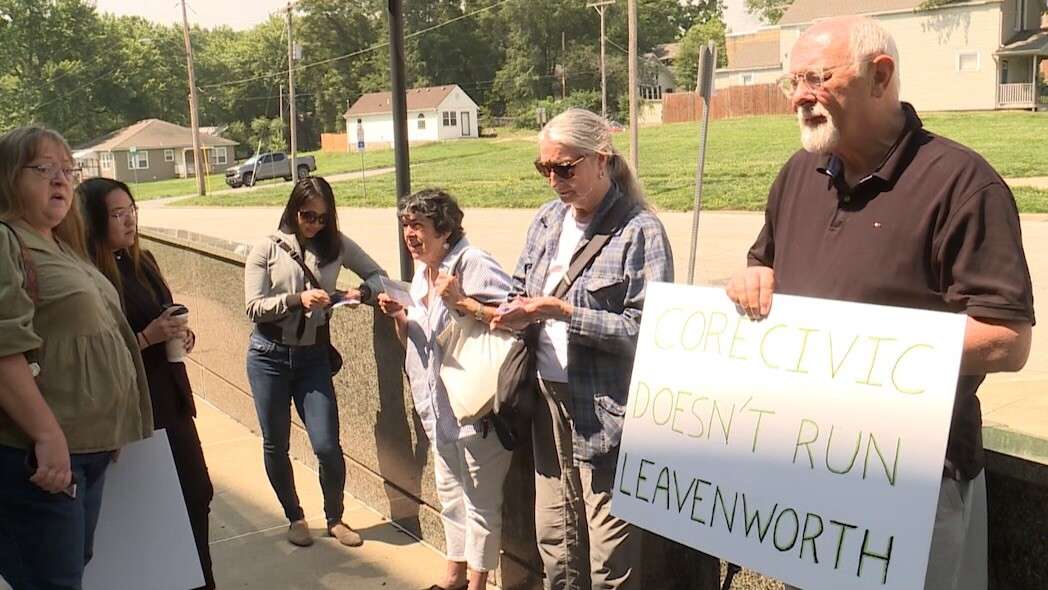 holding up sign.jpeg