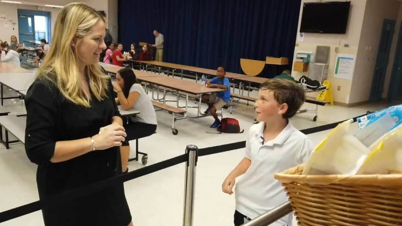 Ashton Lebron (right) with WPTV reporter Tory Dunnan