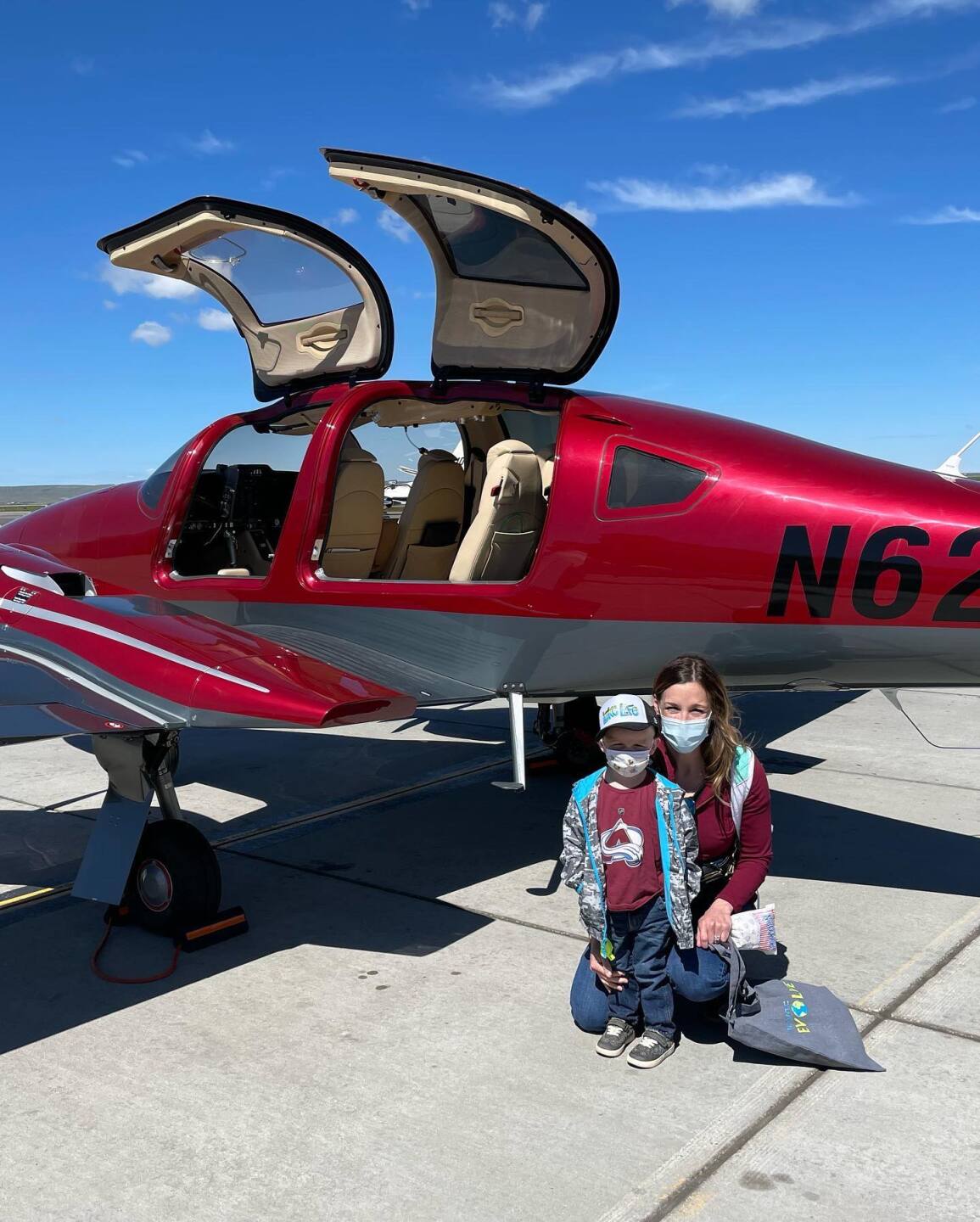 Ashlee and Tristan Voller next to an Angel Flight West volunteer's plane