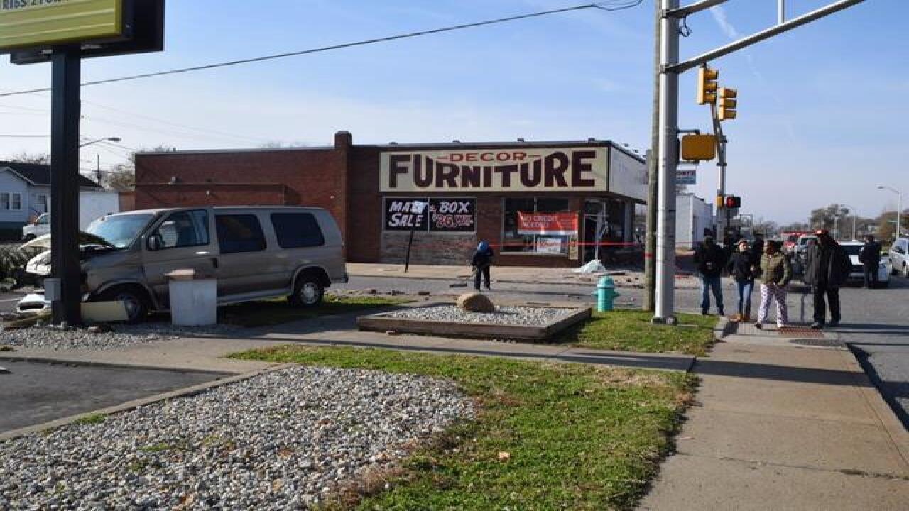 PHOTOS: Van plows into furniture store