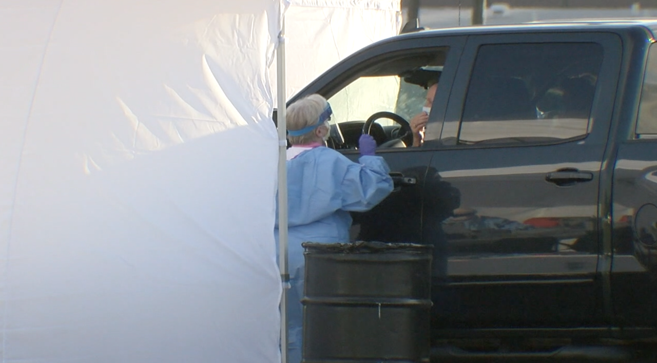 Florida health care worker administers coronavirus test