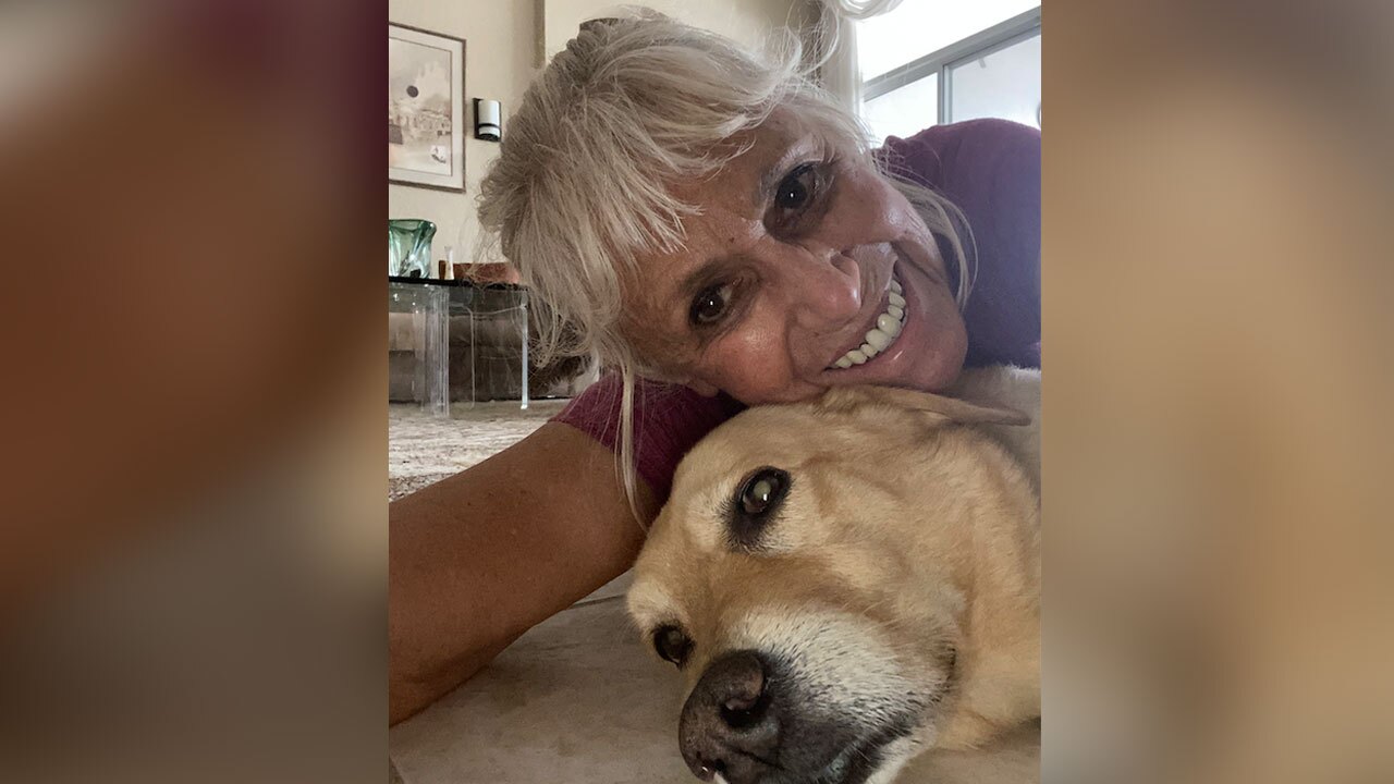 Suzan Marciano with her dog Nalu after they were attacked by an alligator