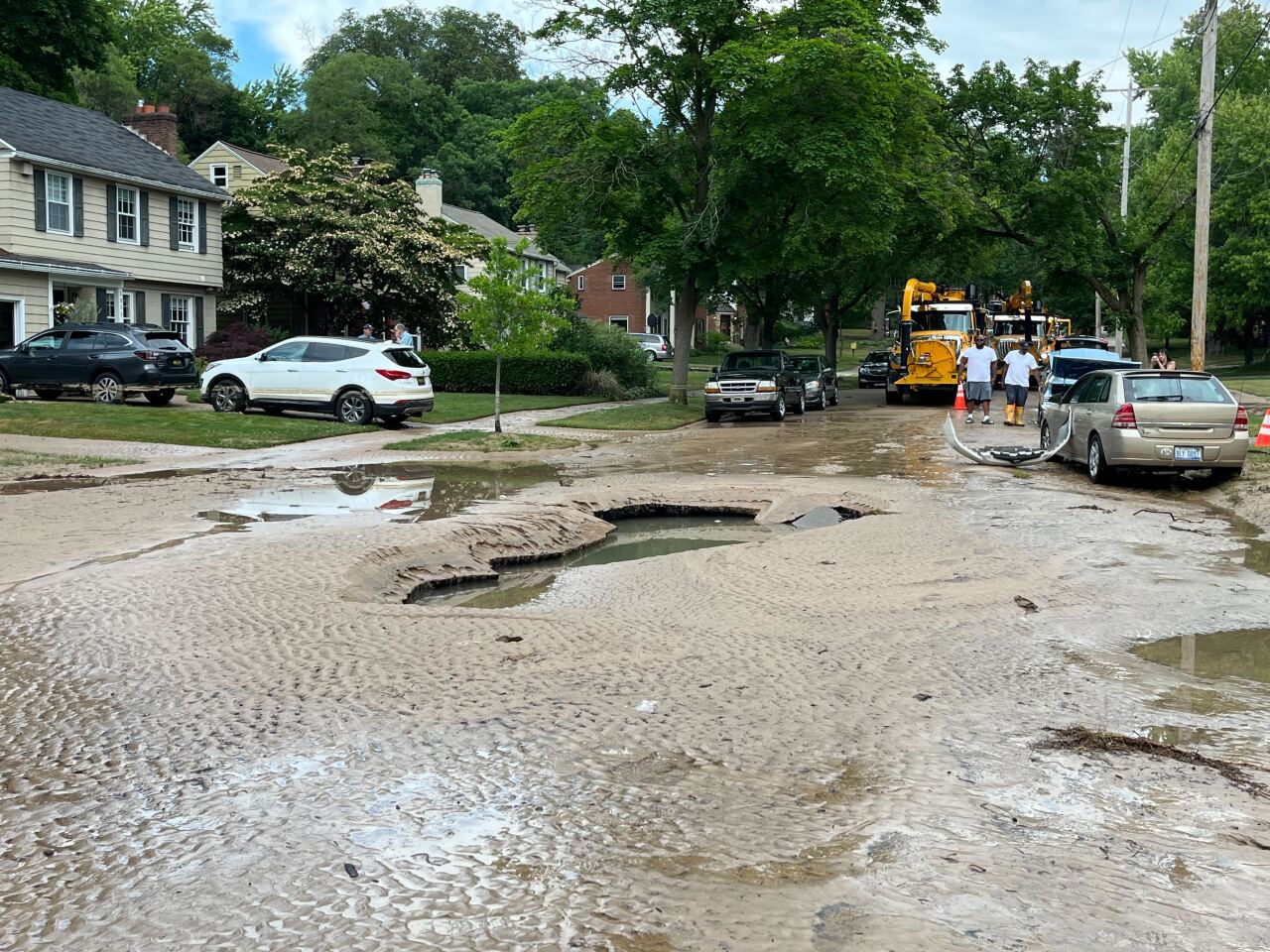 Dirt washed into road - Adams St SE and Philadelphia Ave SE - Southeast Grand Rapids neighborhood flooded by water main break