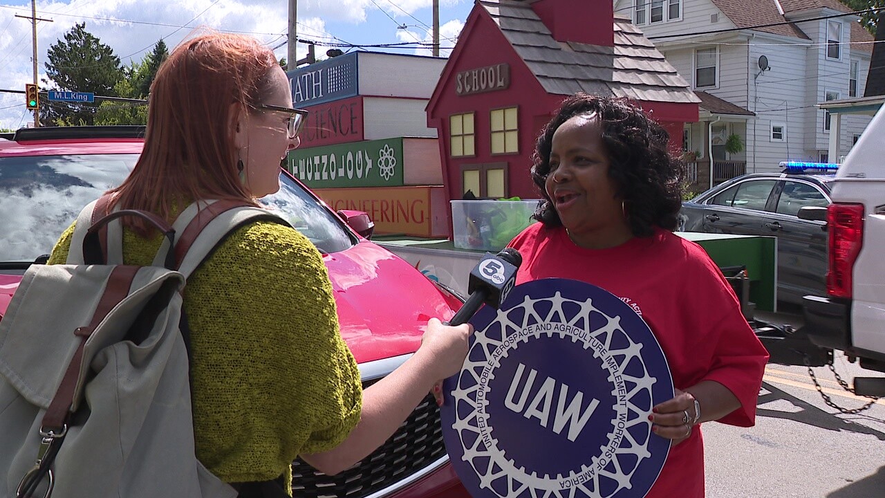 Marjorie Chambers, right, talks to News 5 reporter Michelle Jarboe during the Labor Day parade.