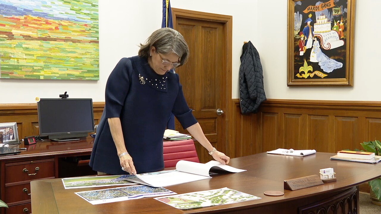 Mayor-President Monique Blanco Boulet looking at documents on her desk
