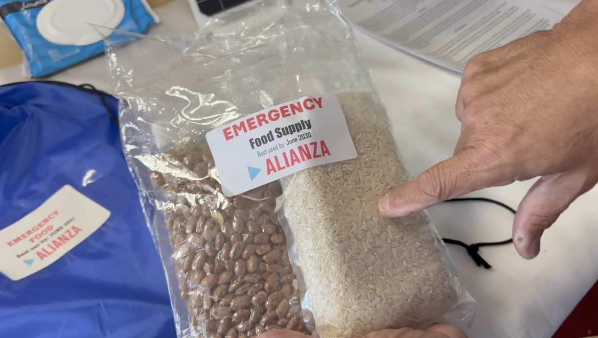Eliseo demonstrates how they package and preserve food
