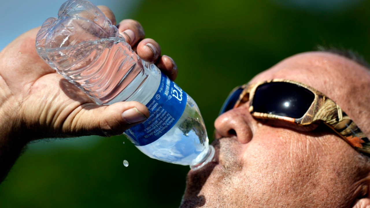 Man drinking water.