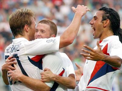 Brian McBride, John O'Brien, and Pablo Mastroeni (l-r), as 2002 USA World Cup Soccer players, celebrate scoring against Portugal, photo