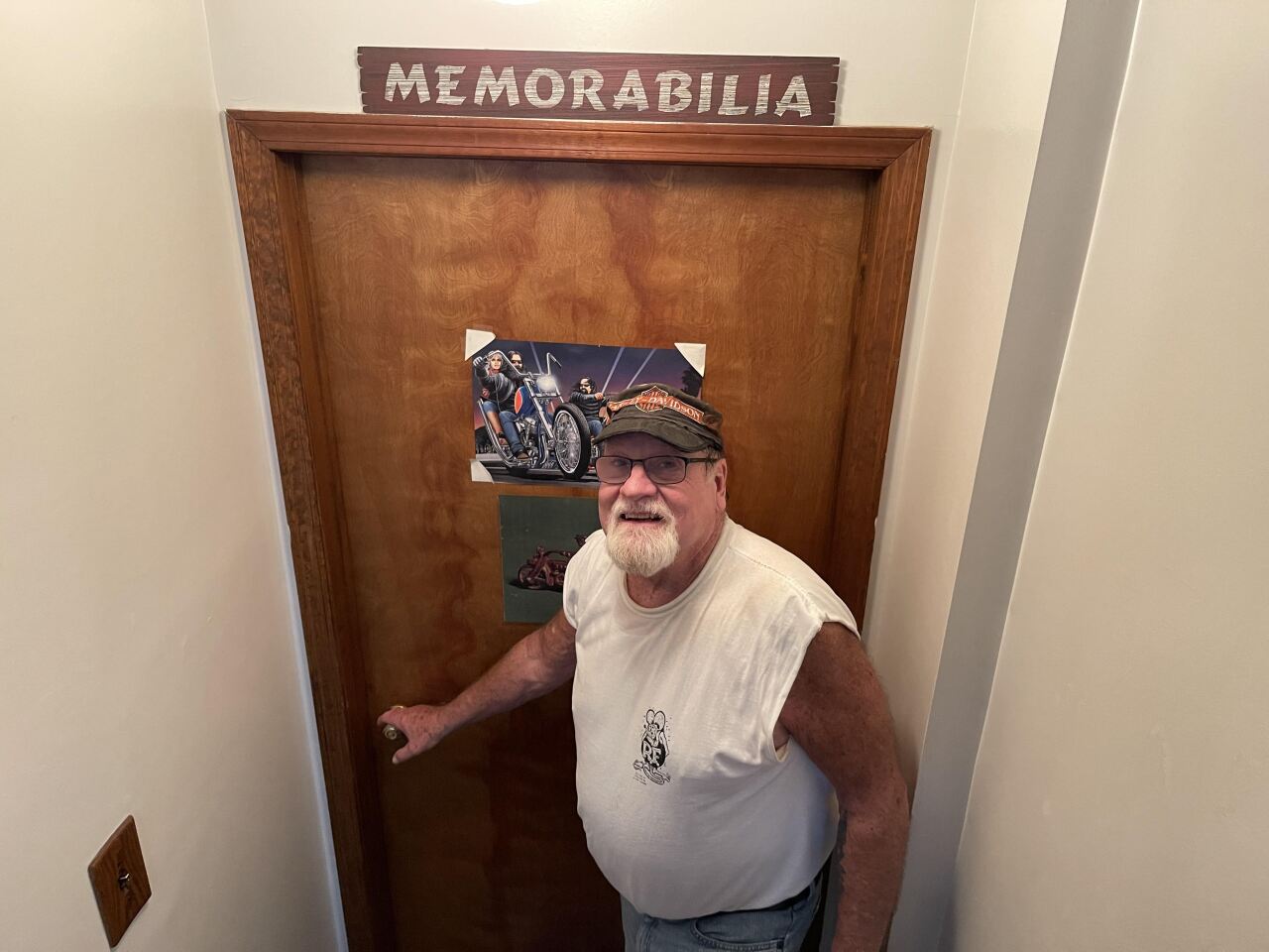 Wayne Caveney getting ready to open the door to his basement .jpeg