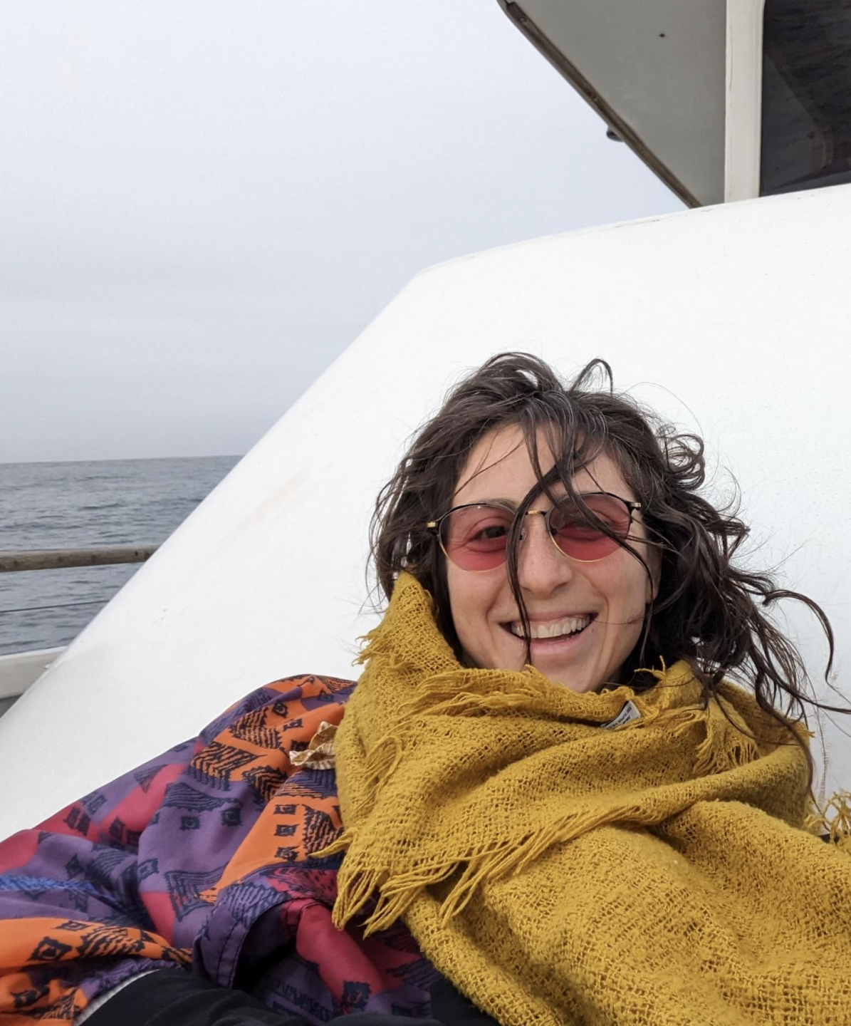 Jana wearing pink-tinted glasses that help filter out a specific wavelength of light that can be uncomfortable following a concussion