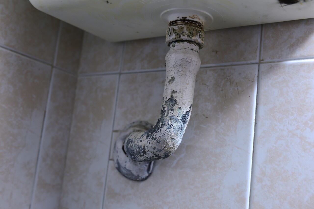 Lead pipe under a sink