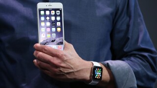 Tim Cook shows off a new version of the iPhone 6 and Apple Watch.