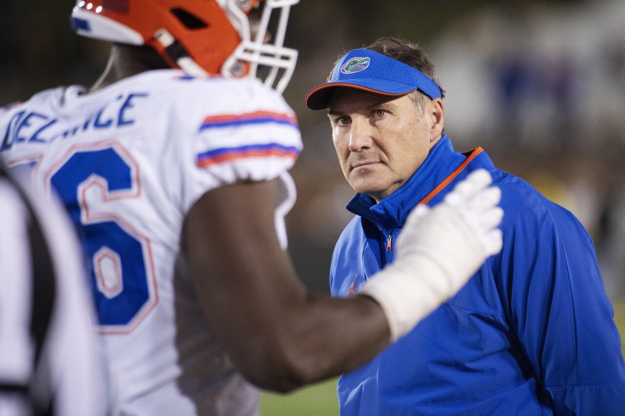 Florida Gators head coach Dan Mullen looks at players as they walk off field in fourth quarter at Missouri Tigers in 2021