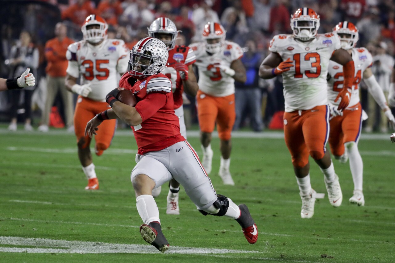 Ohio State Buckeyes QB Justin Fields runs from Clemson Tigers during College Football Playoff semifinal at Fiesta Bowl, Dec. 28, 2019