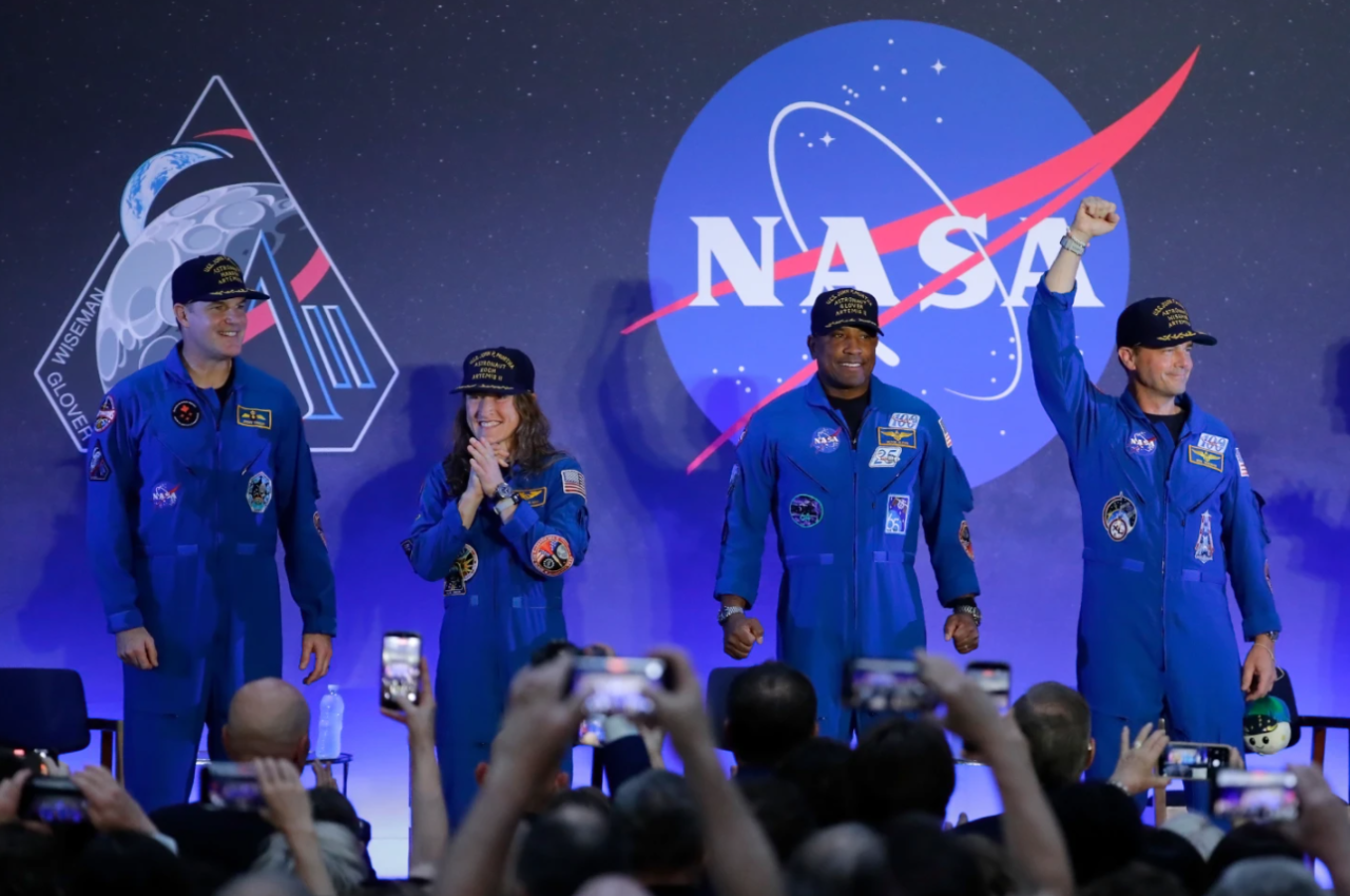 The Artemis II crew, from left, Jeremy Hansen, Christina Koch, Victor Glover and Reid Wiseman acknowledge the crowd as they take the stage during a crew return event Saturday, April 11, 2026, at Ellington Airforce Base in Houston.