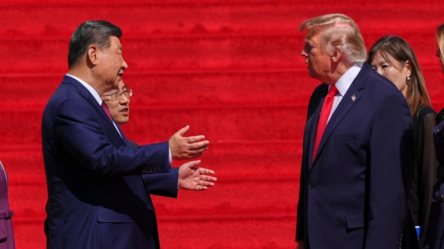 China's President Xi Jinping, left, speaks with President Donald Trump on the steps of the National Archives Museum, Friday, Sept. 25, 2026, in Washington.