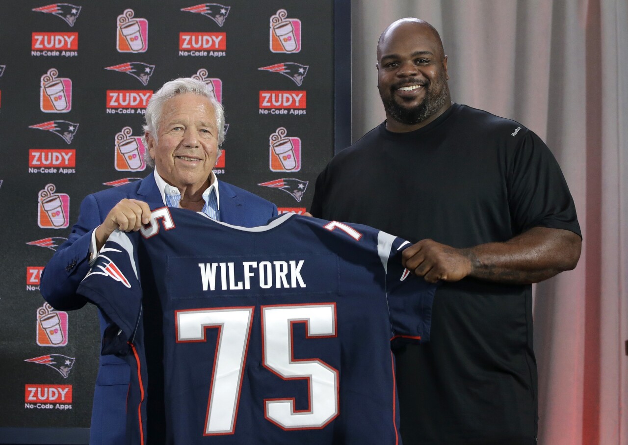 Vince Wilfork holds New England Patriots jersey with Robert Kraft as he announces retirement