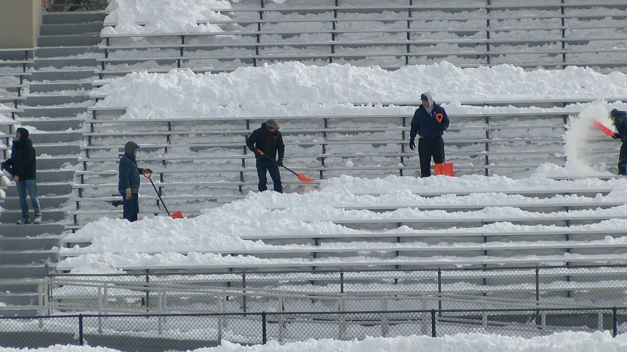 Volunteers help clear snow from Jeffco football stadium ahead of big