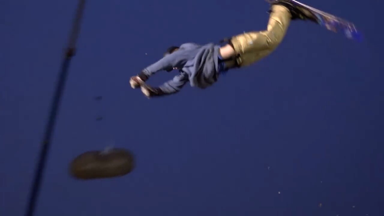 Justin "Juice" Kennedy flies through the air with the potato in the background